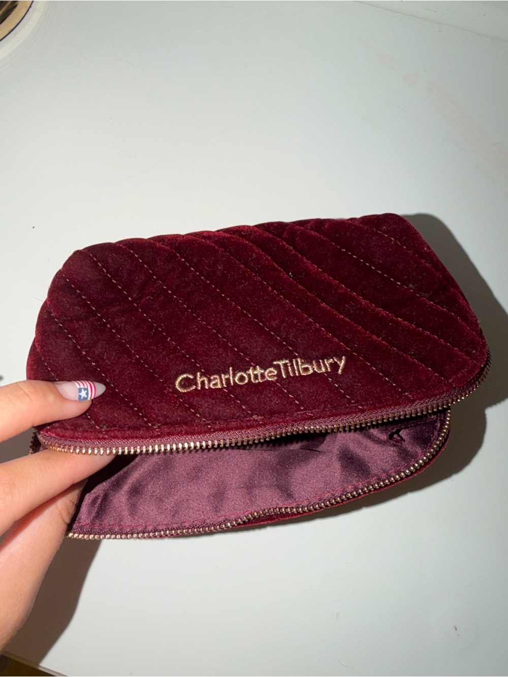 Charlotte Tilbury Deep Burgundy Quilted Velvet Cosmetic Pouch With Gold Logo View 2